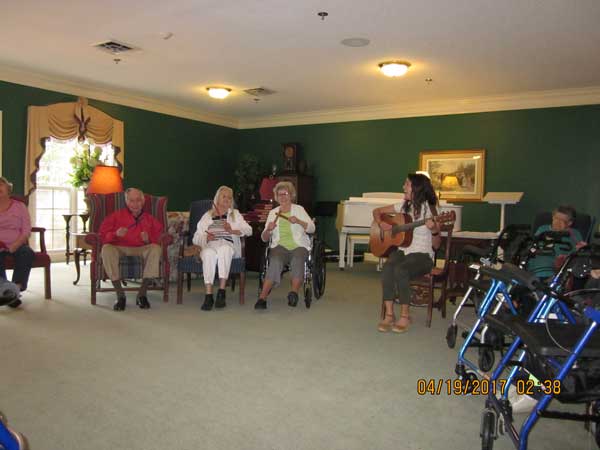 Retired residents enjoying music therapy in athens.