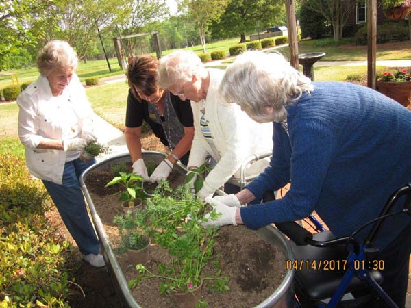 Planting a community garden at our retirement center.